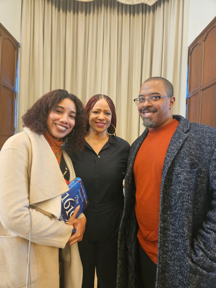 A photo of the author, his wife, and Nikole Hannah-Jones